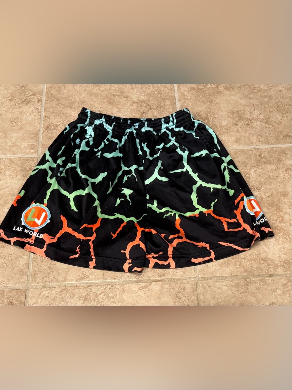 Lax World black, orange, green  pattern lacrosse shorts YM